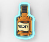 a bottle of whiskey sitting on top of a table