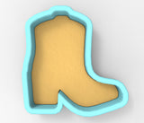A blue-bordered cookie cutter shaped like a cowboy boot.