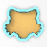 a cookie cutter with a cookie shaped like a bear