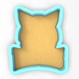 a cookie shaped like a pillow on a white background