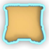 a blue and yellow pillow on a white background