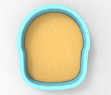 A blue bowl with a yellow substance inside, likely sand or a similar material.