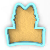 a cookie cutter with a cookie in the shape of a cat