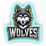 a wolf head with the word wolverines on it