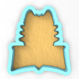 a cookie cutter shaped like a tree