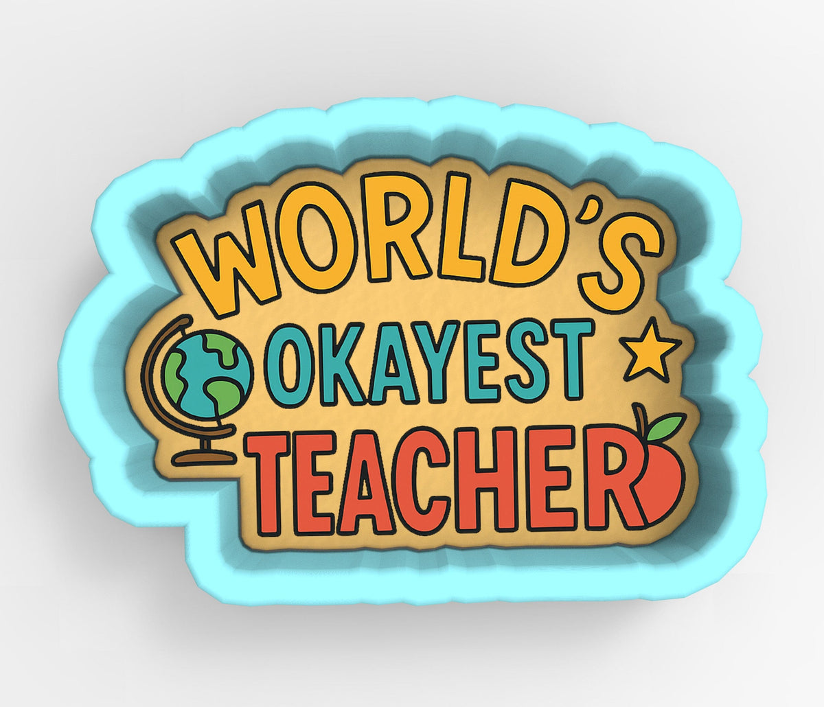 a cookie cutter shaped like a speech bubble with the text "WORLD'S OKAYEST TEACHER" written on it.