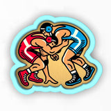 a sticker of two men wrestling each other