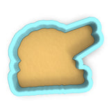 a cookie cutter with a piece of bread in it